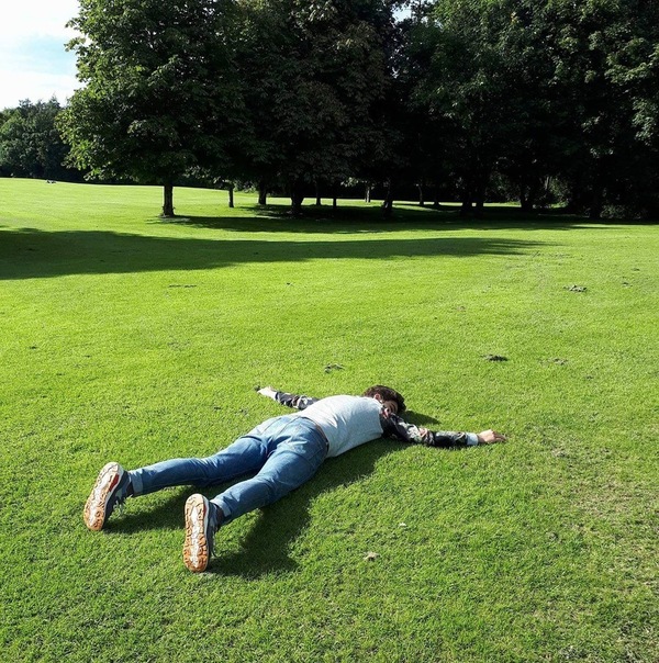 Me lying on grass